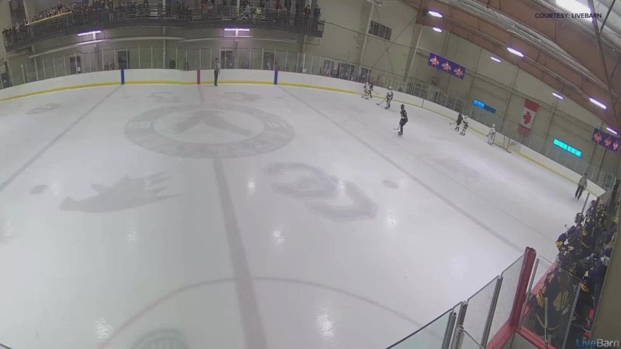 Teen Kicks Opponent with Skate During Hockey Game