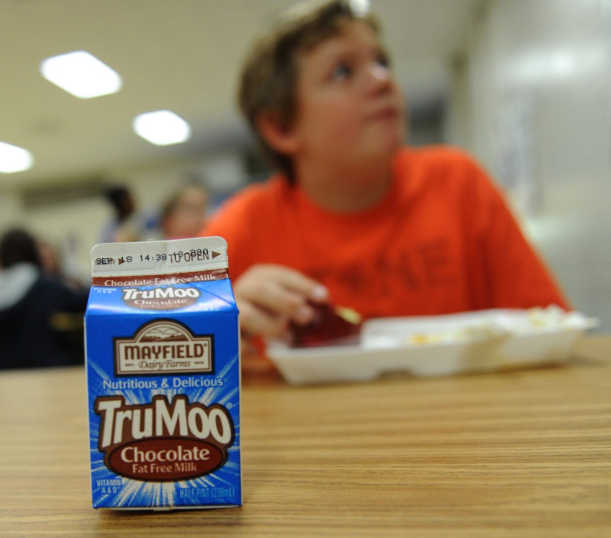 September 6, 2012 - Decatur: This empty carton of chocolate milk sits on the  table as Diego Wren,13, talks to a classmate during lunch at Renfroe Middle School in Decatur on Thursday, September 6, 2012.  While many have fond memories of a childhood chill warmed by hot cocoa or of a thirst slaked by a cold glass, the very notion of the drink is on trial in Decatur. The school board just voted unanimously to consider a parent committees recommendation to ban the sweet, sugary drink from school cafeterias. Their argument: the calories outweigh the nutritional benefits.  JOHNNY CRAWFORD /JCRAWFORD@AJC.COM