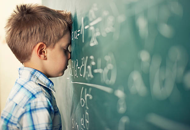 Little+boy+in+math+class+overwhelmed+by+the+math+formula.