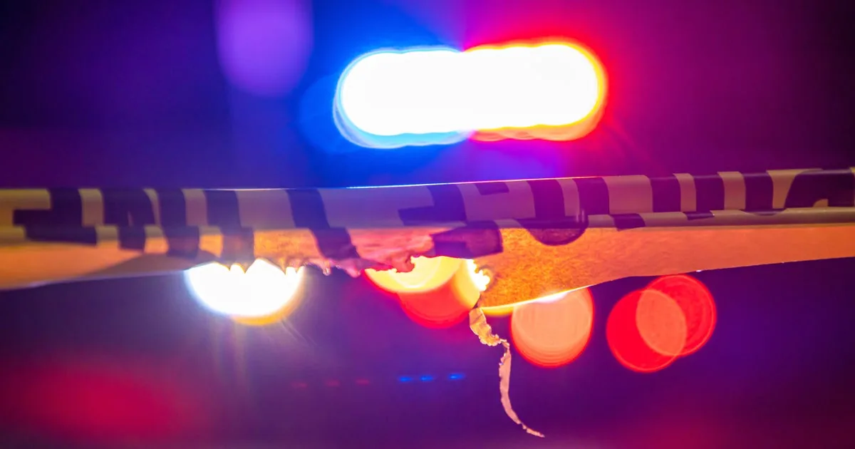 Police tape outside an apartment complex during a cold case investigation